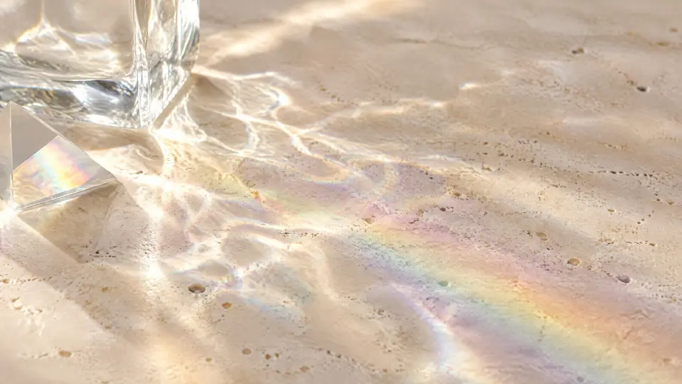 Caustic light and a small rainbow on honed stone